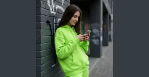 A girl on a colourful track suit